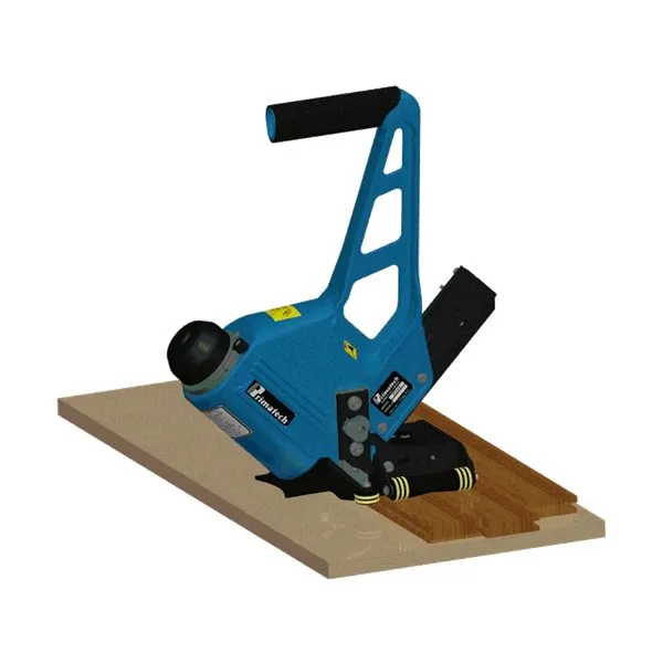 A blue machine is on top of some wood.