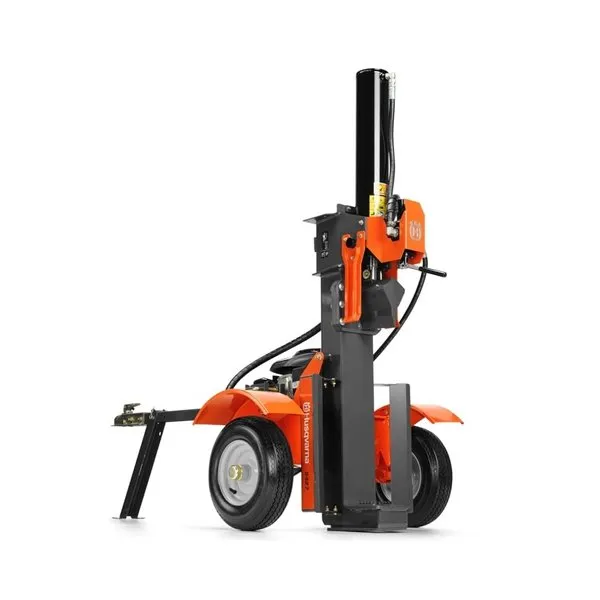A small orange and black machine is on the ground