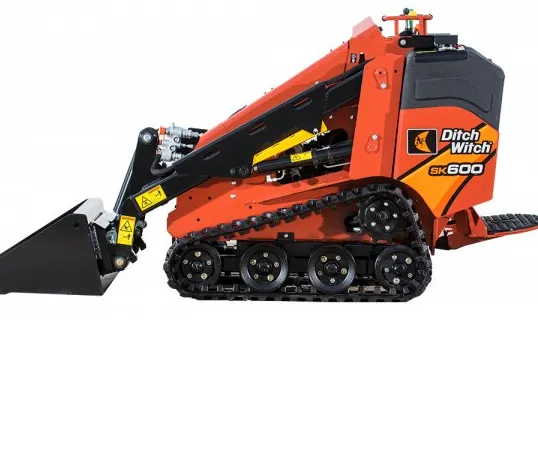A small orange and black tractor is on the ground