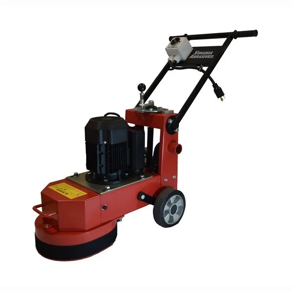 A red machine is on the ground with wheels.
