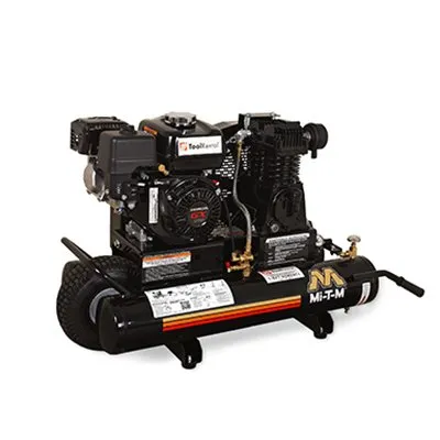 A black engine with a hose attached to it.