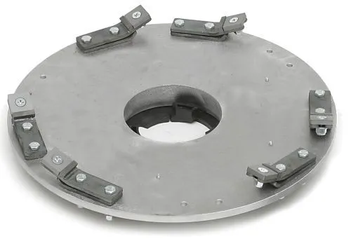 A metal disc with four blades on it.
