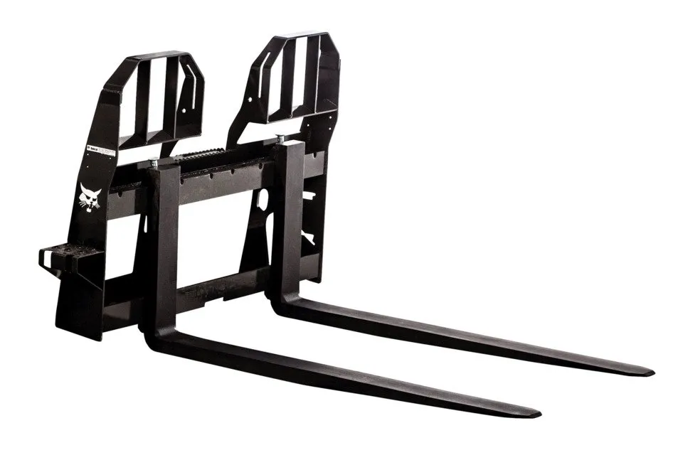 A black fork attachment for a tractor.