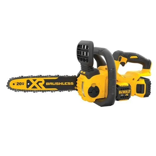 A yellow and black chainsaw is on the ground