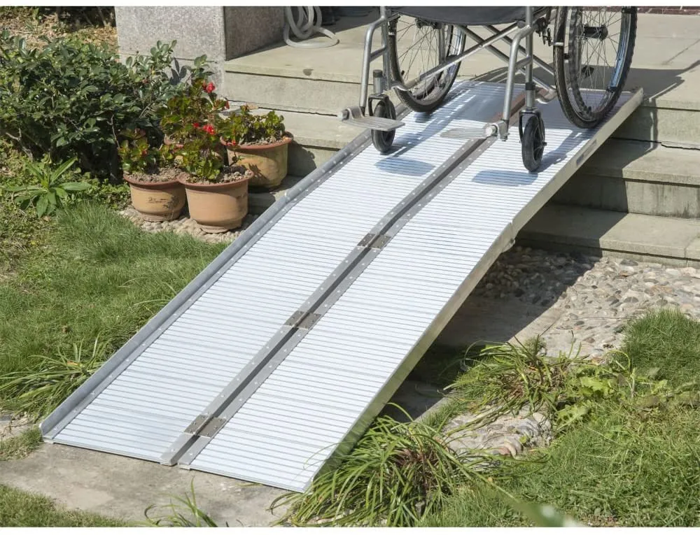 A wheelchair ramp is shown in the grass.