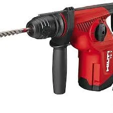 A red and black drill with a long handle