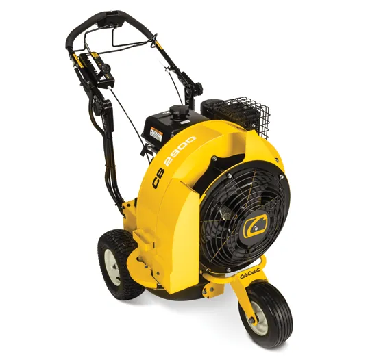 A yellow and black blower is on the ground