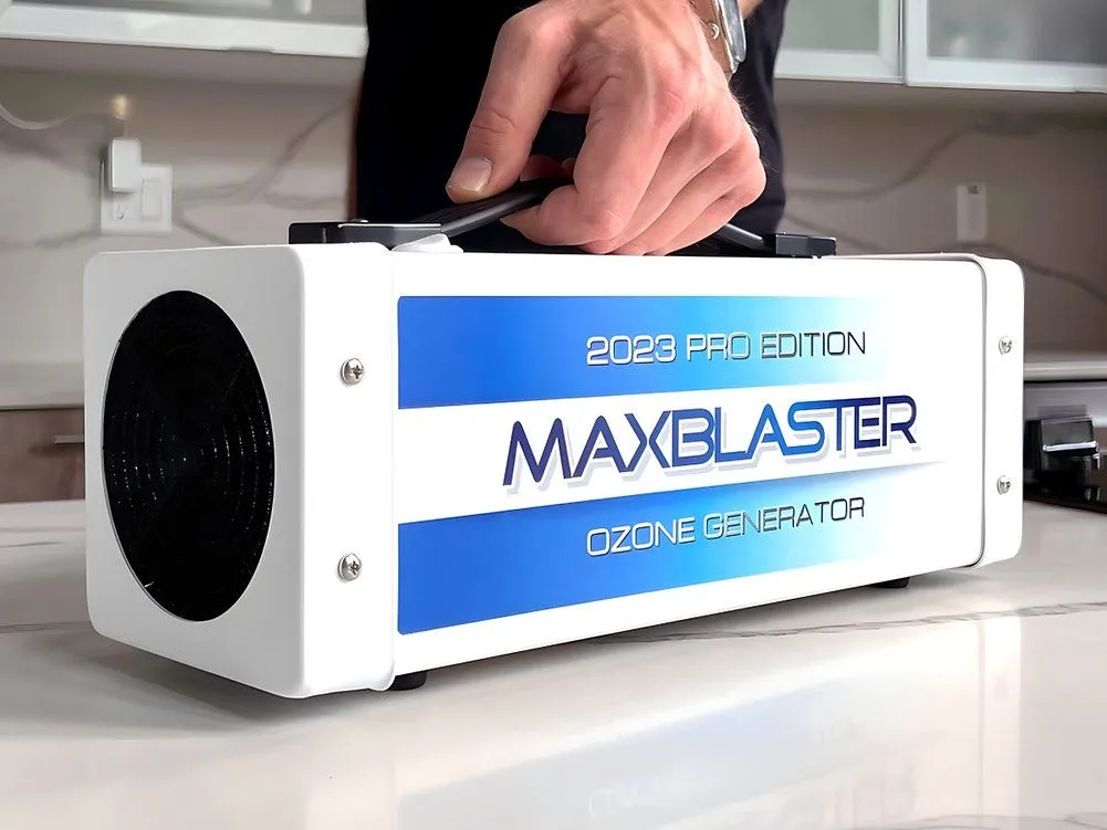 A person is holding the box for an ozone generator.