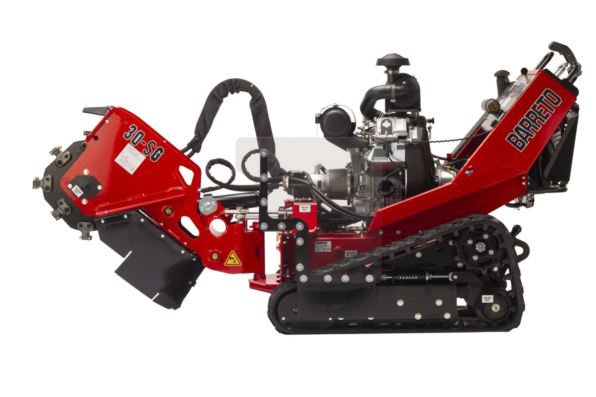 A red and black machine is on the ground